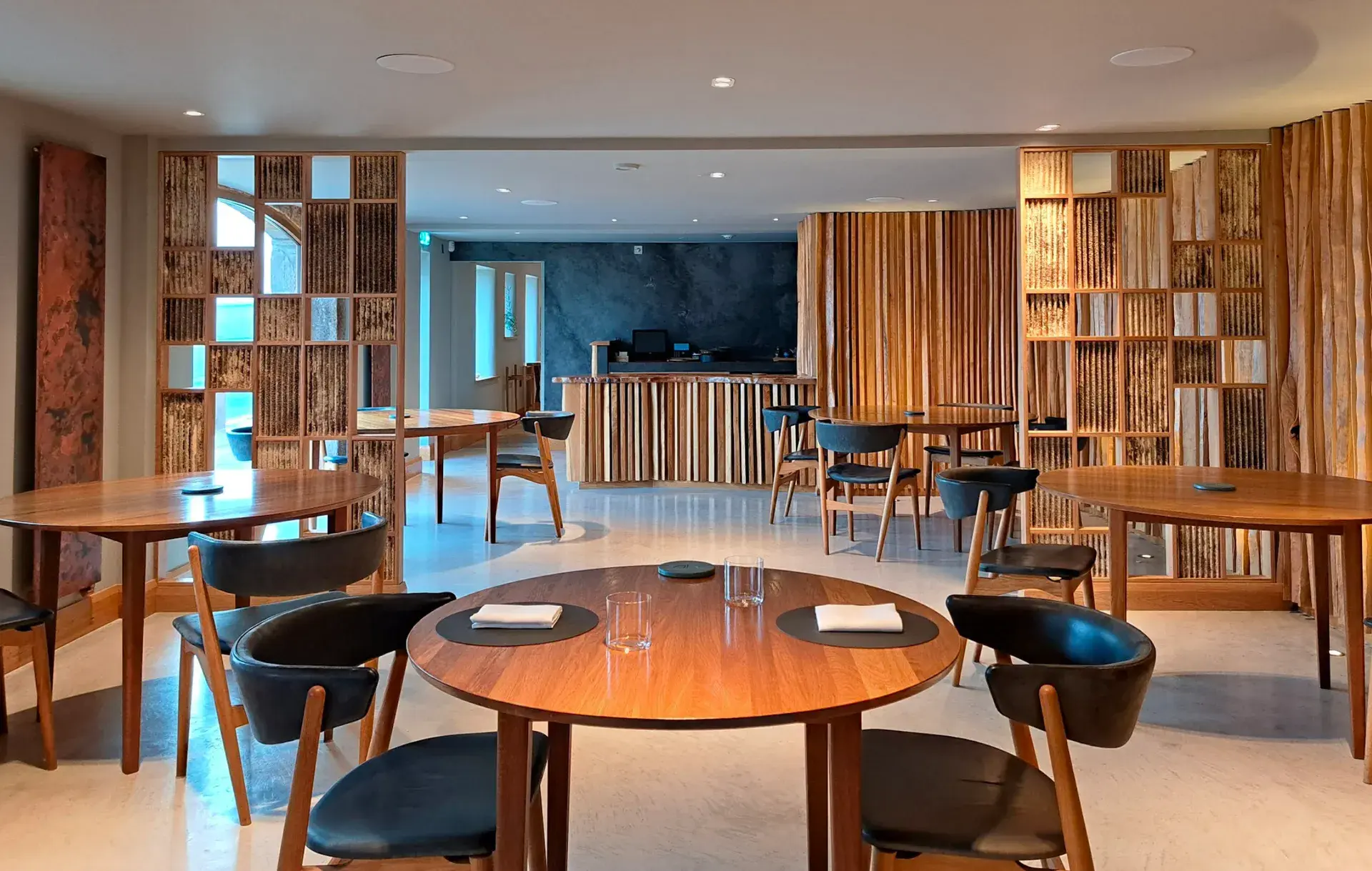 Mycelium panels integrated into timber screens throughout a London restaurant